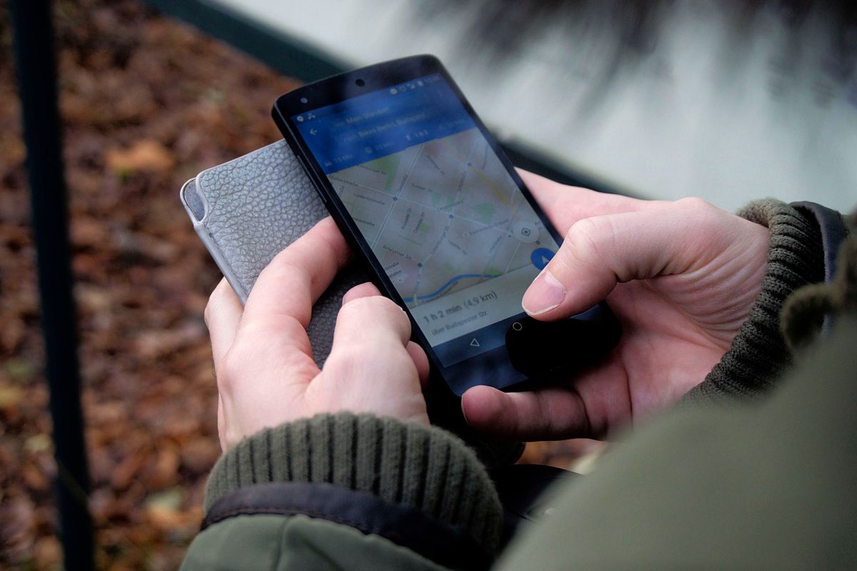 Person navigating Google Maps on a smartphone